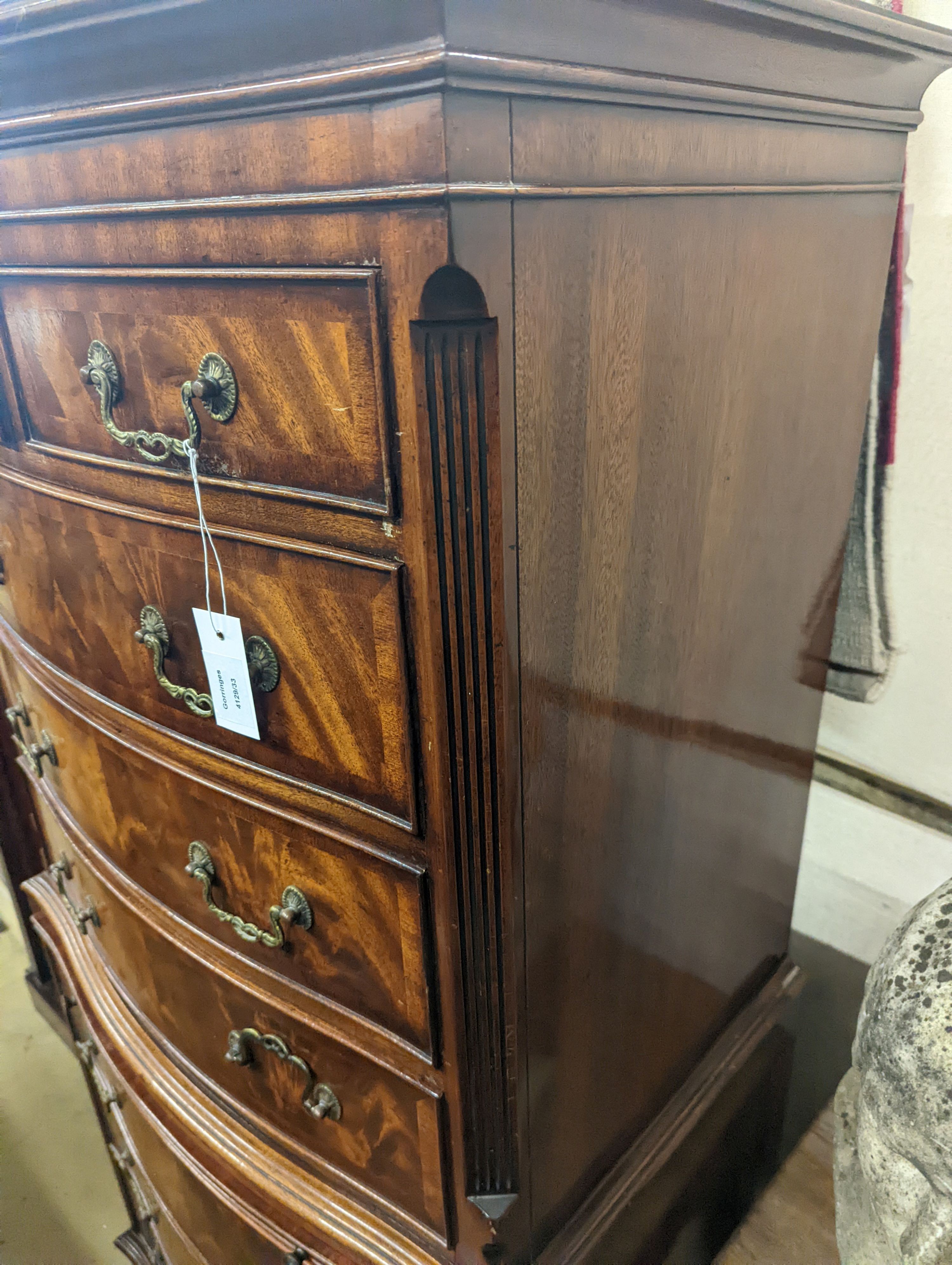 A reproduction George III style mahogany bow front tallboy fitted slide, width 73cm, depth 48cm, height 152cm